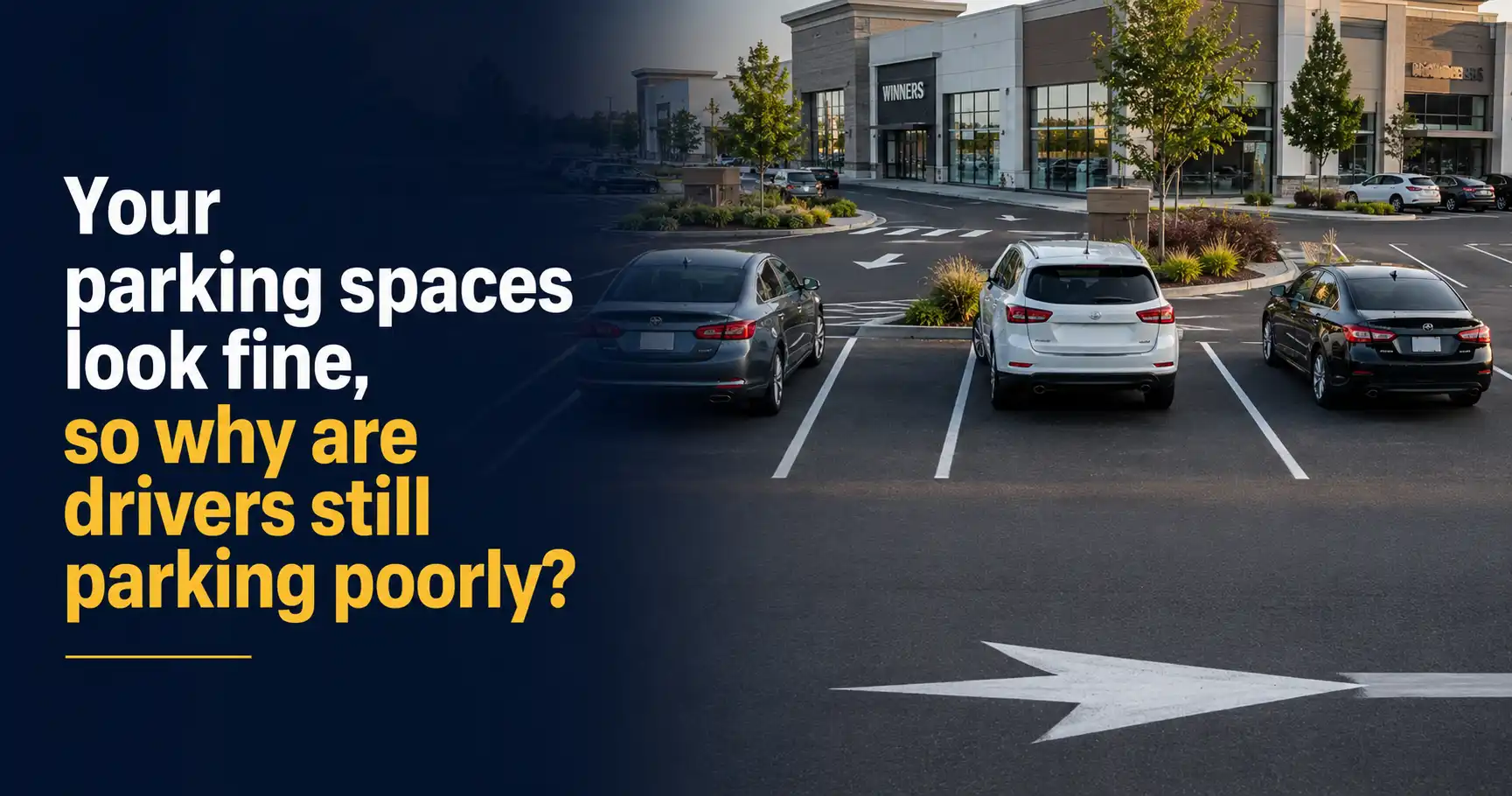 Freshly painted commercial parking spaces with crisp white stall lines, directional arrows, landscaped medians, and retail storefronts, showcasing professional Commercial Parking Space Painting that improves parking organization and traffic flow.