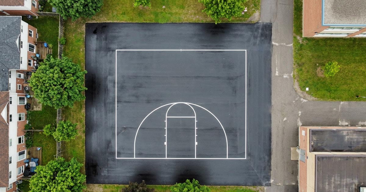 Freshly painted sports court lines for recreational surfaces